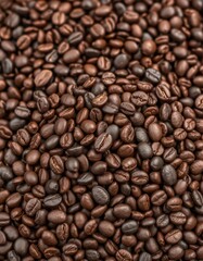 Fototapeta premium Dark brown pile of coarsely ground coffee beans, rich aroma implied, drink, energy, caffeine