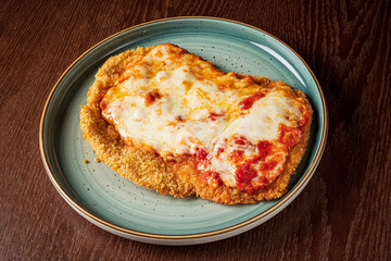 .schnitzel with cheese and sauce