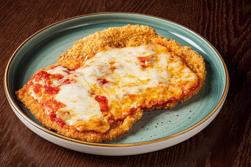 .schnitzel with cheese and sauce