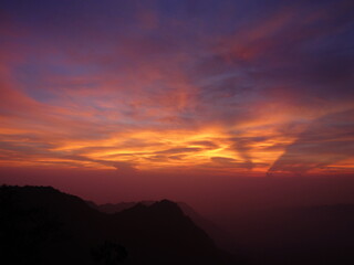 Crimson Peaks: Sunset Over a Dreamlit Range