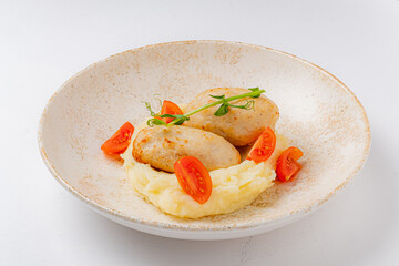 chicken cutlet with mashed potato and tomatoes