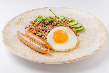buckwheat with fried egg and sausage