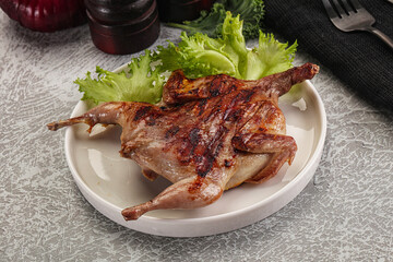 Grilled quail in the plate