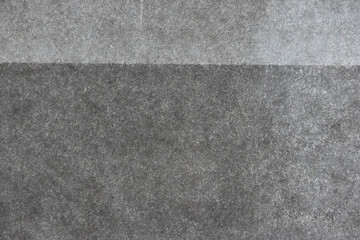 Black and gray dots printed on white paper.