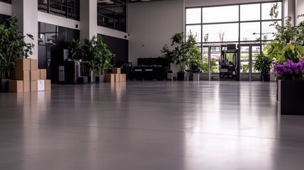 Fototapeta premium Spacious modern office interior with large windows potted plants and cardboard boxes A bright and airy workspace
