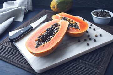 Sliced GMO Papaya on Cutting Board Vibrant Orange Flesh and Optimized Growth Representation