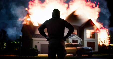 Arsonist In Front Of House On Fire