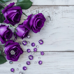 flat lay of purple roses and tiny diamonds on a rustic white wooden surface