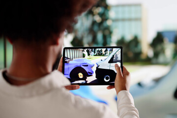 Driver in blue suit documenting car damage