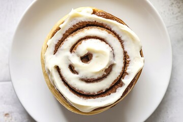 a cooked, baked Cinnabon with a swirl of cream on top