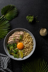 asian noodles with chicken, egg and broccoli 