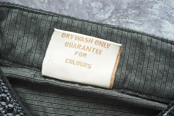 Care label instructions for garment emphasizing color preservation