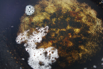 old cooking oil in a cooking pan 