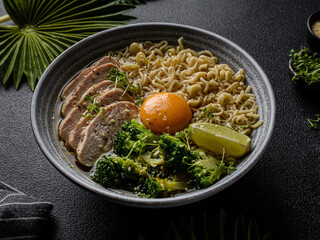 asian noodles with chicken, egg and broccoli 