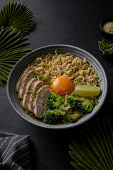 asian noodles with chicken, egg and broccoli 
