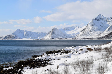 
Norway arctic landscape with snow mountains in the background