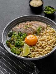 asian noodles with chicken, egg and broccoli 