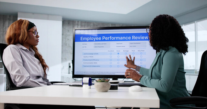 American woman filling out online employee evaluation form