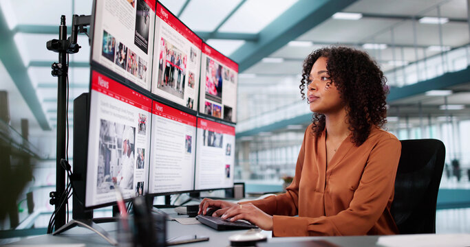 Woman Looking At News In Online Newspaper