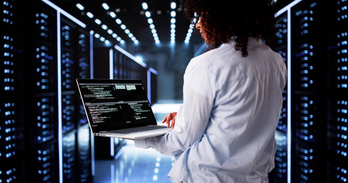Cloud Computer Engineer Coding In Server Room In Data Center - Powered by Adobe