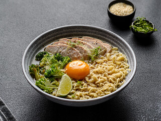 asian noodles with chicken, egg and broccoli 