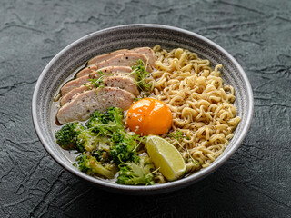 asian noodles with chicken, egg and broccoli 