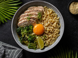 asian noodles with chicken, egg and broccoli 