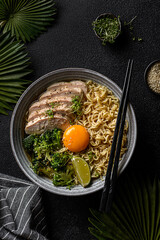 asian noodles with chicken, egg and broccoli 