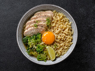 asian noodles with chicken, egg and broccoli 