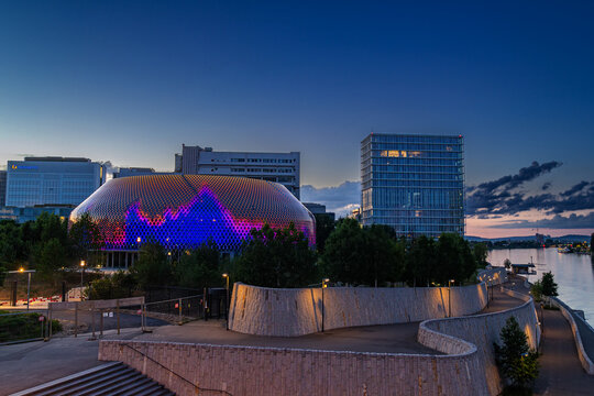 Basel, Switzerland - 16. May 2022: Lightshow on the new Novartis Pavillon at the sunset time. Novartis is a leading pharmaceutical company for medicine research and products.