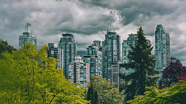 Tall buildings rise among lush green trees under a dramatic sky. The contrast between nature and the urban landscape highlights the city&acirc;&euro;&trade;s unique character and beauty.