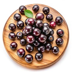 A Collection of Fresh Jaboticaba Fruits on a Wooden Platter