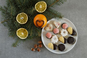 Festive Christmas cookies with dried orange slices and pine branches