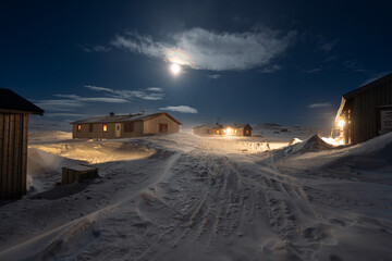 Full moon over Helags Mountain station in Jämtland, Sweden, during a cold and windy night in March.