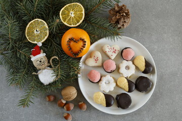 Christmas cookies with festive decorations and pine branches