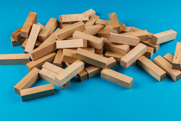 Wooden blocks scattered on a blue surface