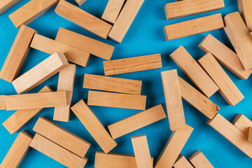 Wooden blocks scattered on a blue background