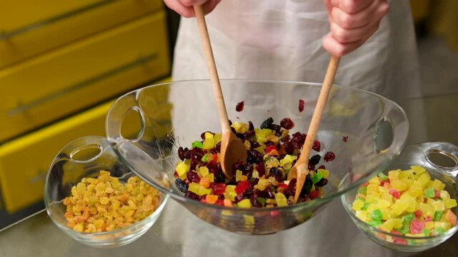 A bowl of dry mix fruit after soaked in rum for making fruit cake. High quality 4k footage