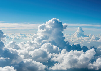 A breathtaking aerial perspective of puffy white clouds blanketing the azure sky.