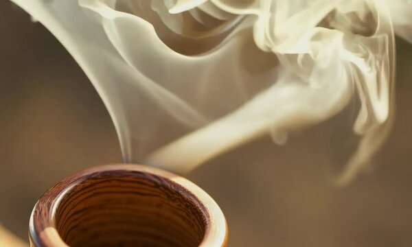 A pipe with smoke coming out of it