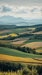 Obraz premium Scenic Rolling Farmland with Beautiful Patchwork Fields and Distant Hills