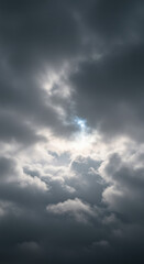 Obraz premium Moody storm clouds fill the sky, with a small patch of blue peeking through.