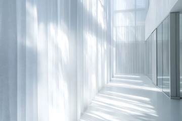 Obraz premium Bright modern corridor with sheer white curtains and sunlight casting shadows on the floor