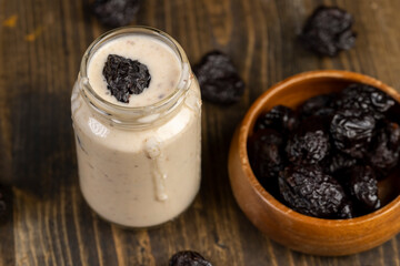 fresh cow's milk yogurt with prune flavor with dried plum slices