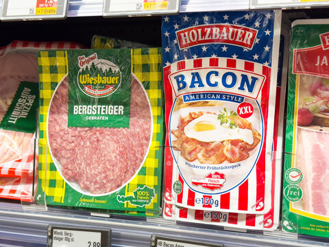 Packaged meats display: wiesbauer bergsteiger and holzbauer bacon in supermarket