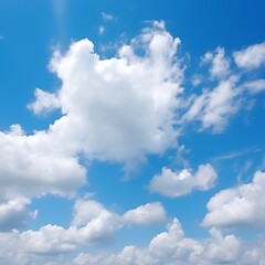 Obraz premium White puffy clouds float in a brilliant blue sky