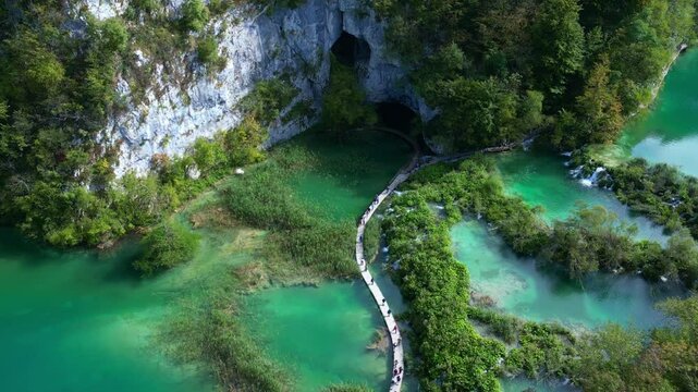 Peaceful nature scene with waterfall. Panoramic aerial view of waterfalls. Beauty green nature. Plitvice lakes and Waterfall. Beauty waterfall landscape in Croatia. Summer view of Plitvice lakes.