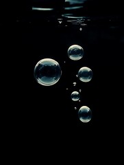 Bubbles underwater, dark background