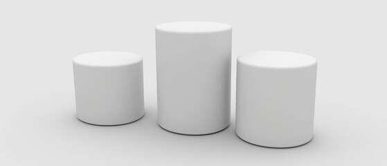 Three white cylindrical pedestals, ascending in size, on a white background