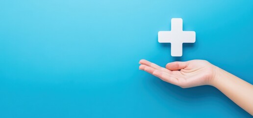 Obraz premium A hand is gripping a striking red cross symbol set against a blue background